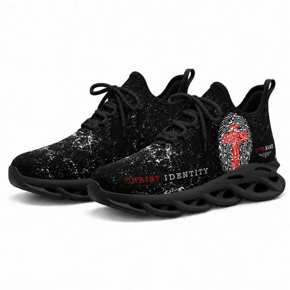 Angled studio shot of black-soled religious footwear featuring the Christ Identity design
