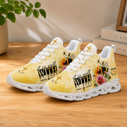 Lifestyle display of Christian bumblebee Max Soul shoes with white soles styled on a rustic wooden table