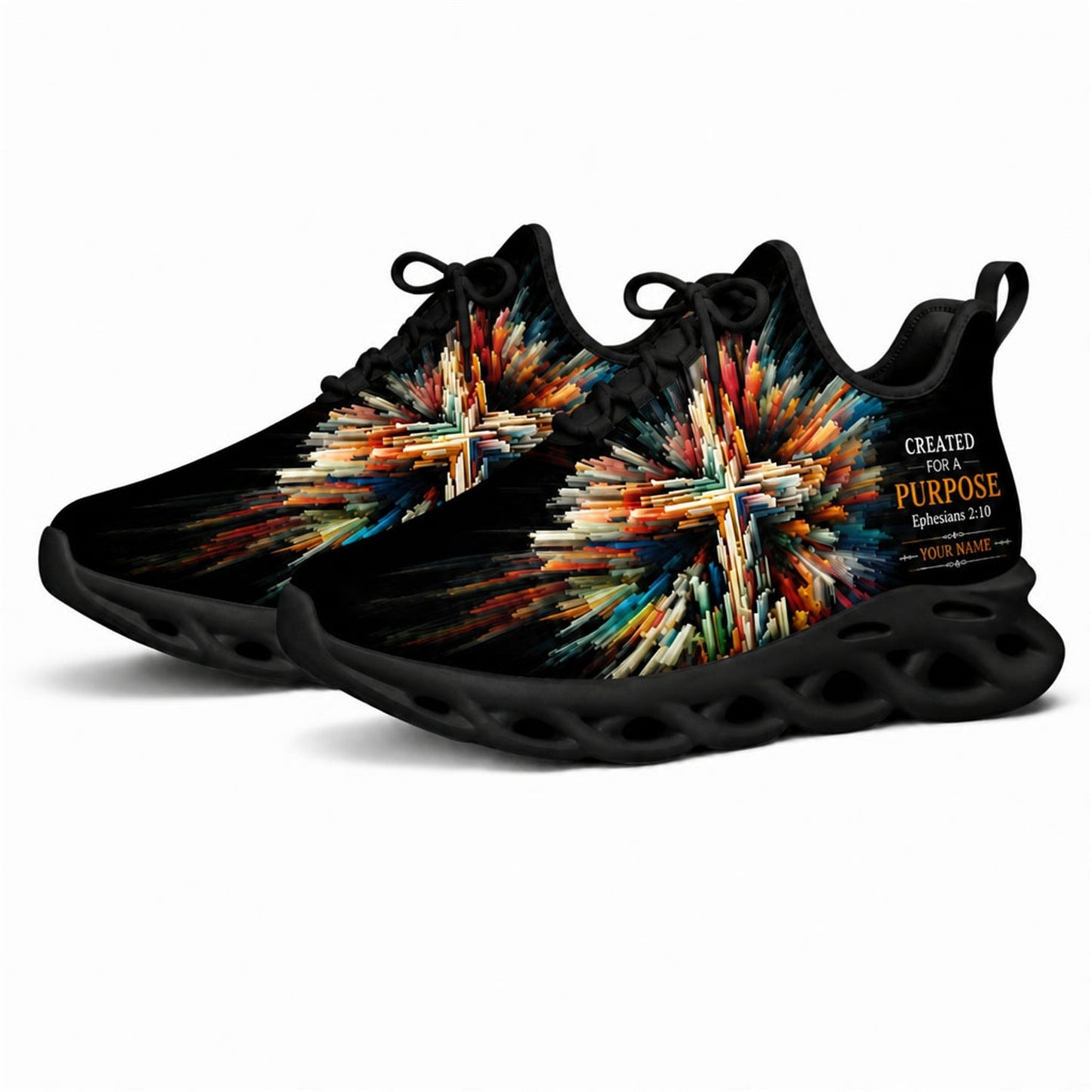 Angled studio shot of black-soled religious footwear featuring the abstract colorful cross motif
