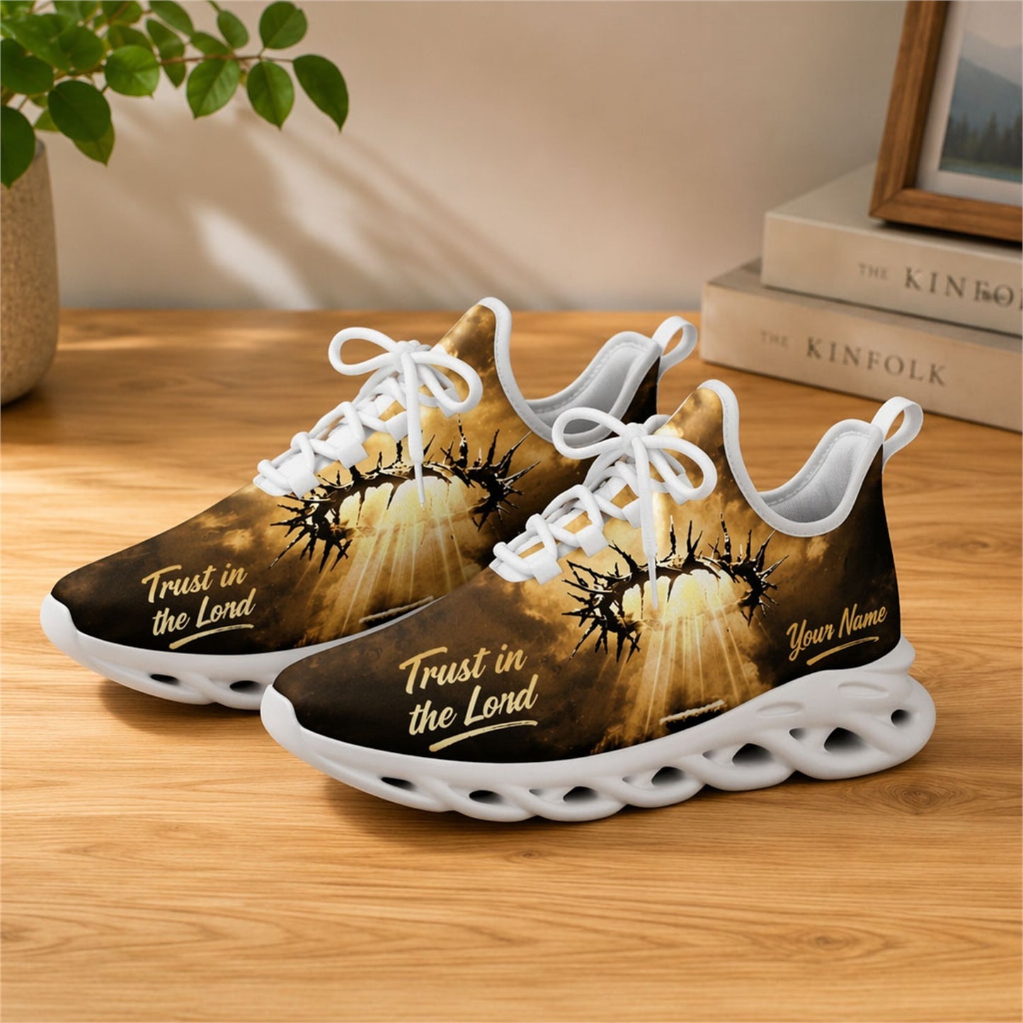 Lifestyle view of white-soled faith sneakers on wood, displaying the personalized name zone and gold script text