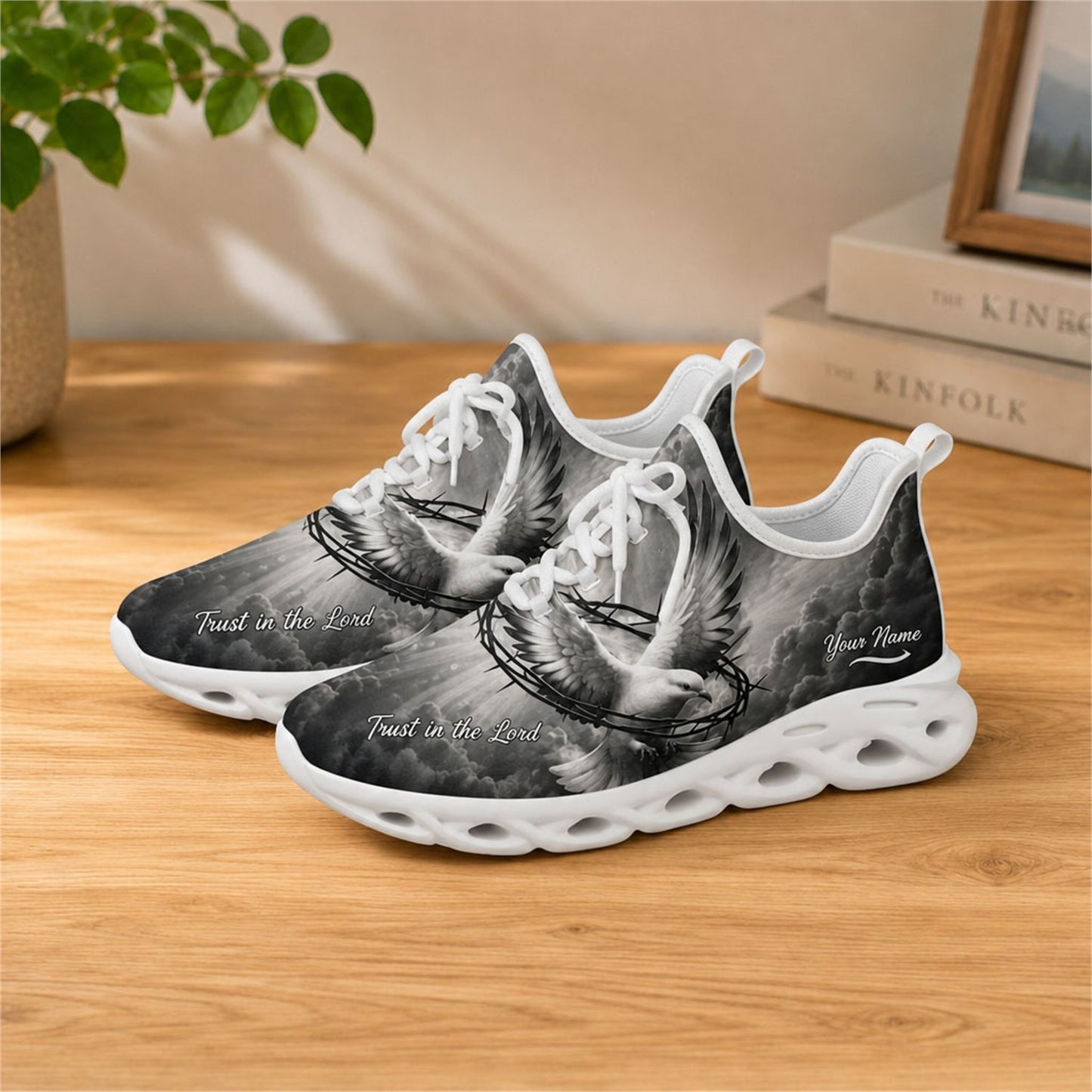 Lifestyle view of white-soled faith footwear on a wooden table, showcasing the "Trust in the Lord" script