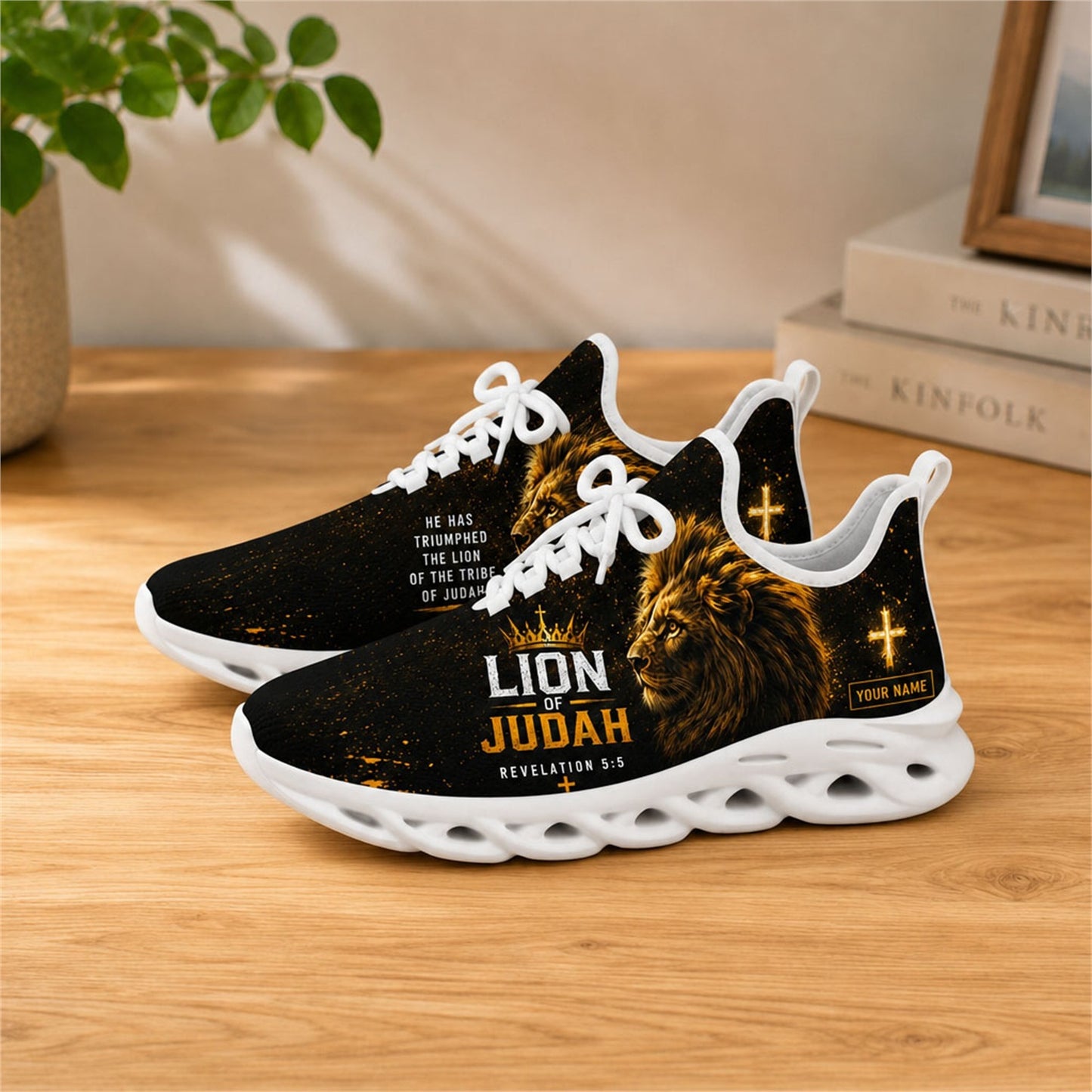Lifestyle view of white-soled Lion of Judah sneakers on a wooden surface
