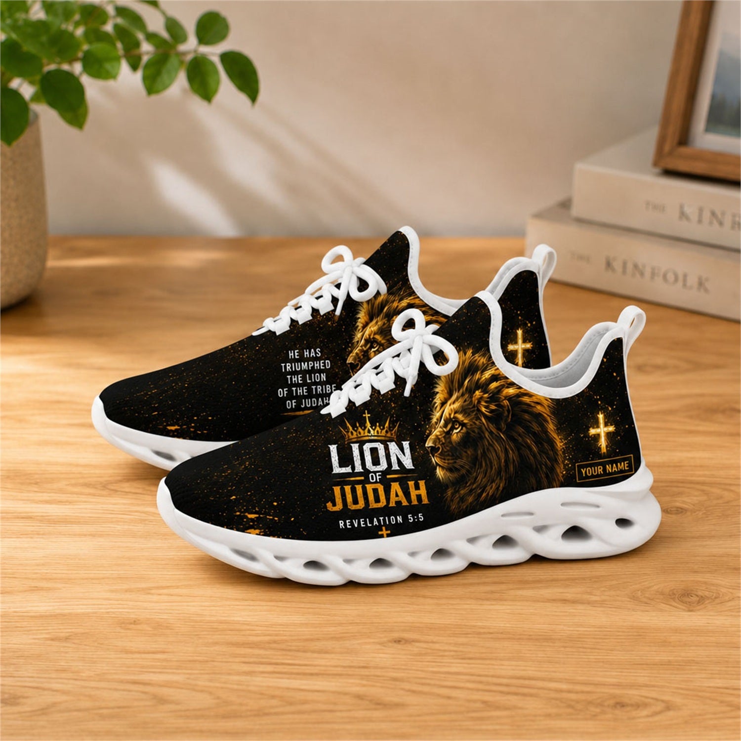 Lifestyle view of white-soled Lion of Judah sneakers on a wooden surface