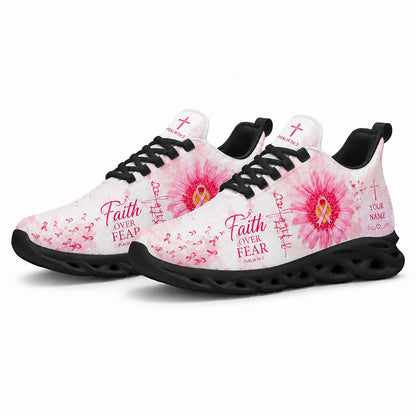 Pair of breast cancer awareness sneakers featuring a vibrant pink daisy canvas print with dynamic black traction soles