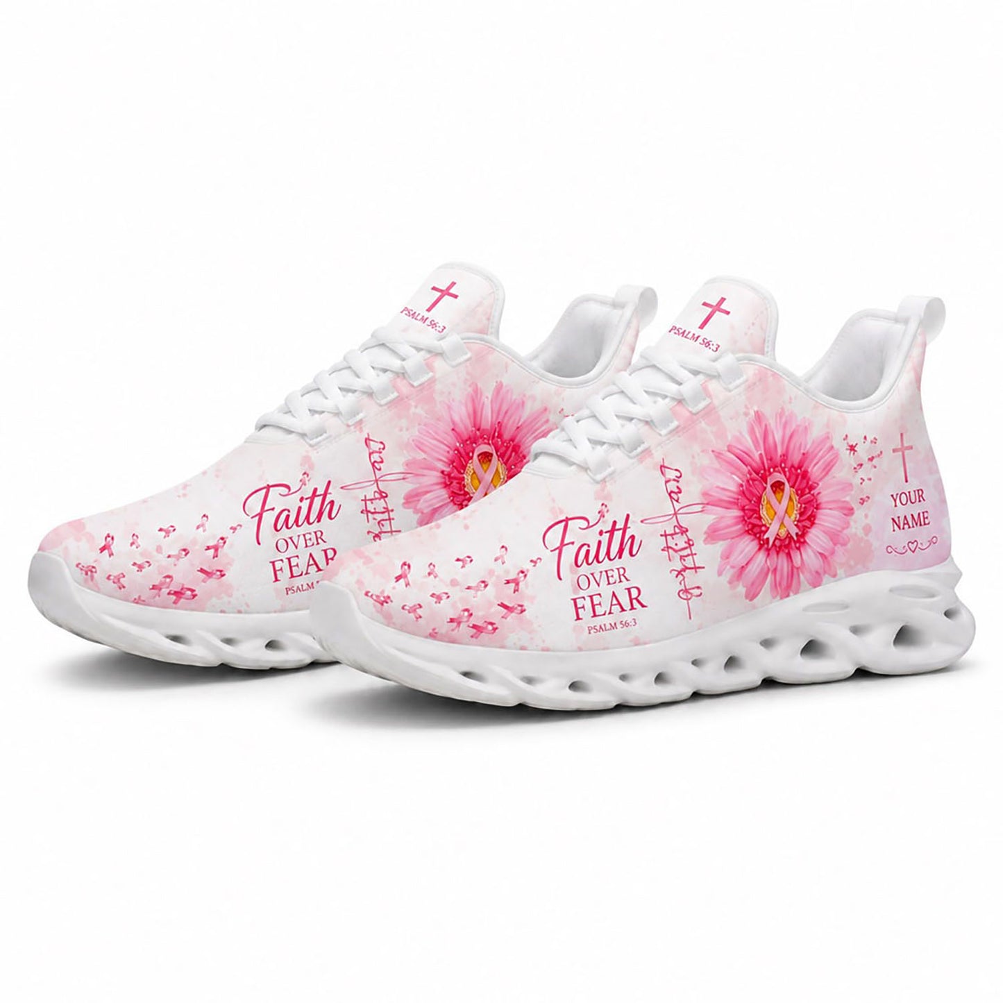 Angled view of a pair of custom breast cancer awareness sneakers with pink watercolor textures and holy crosses on white soles