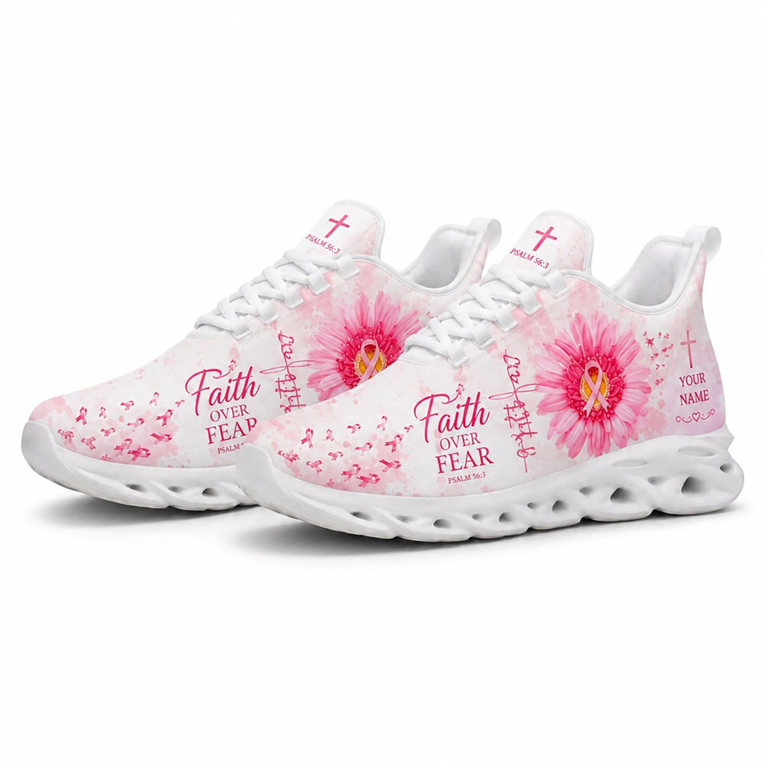 Angled view of a pair of custom breast cancer awareness sneakers with pink watercolor textures and holy crosses on white soles