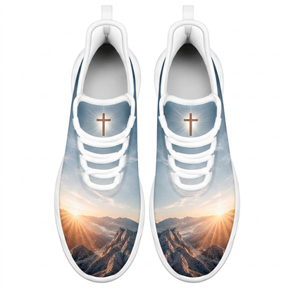Top-down view of the custom sneakers showcasing the mountain sunburst toe boxes and a glowing cross emblem on the tongue panels