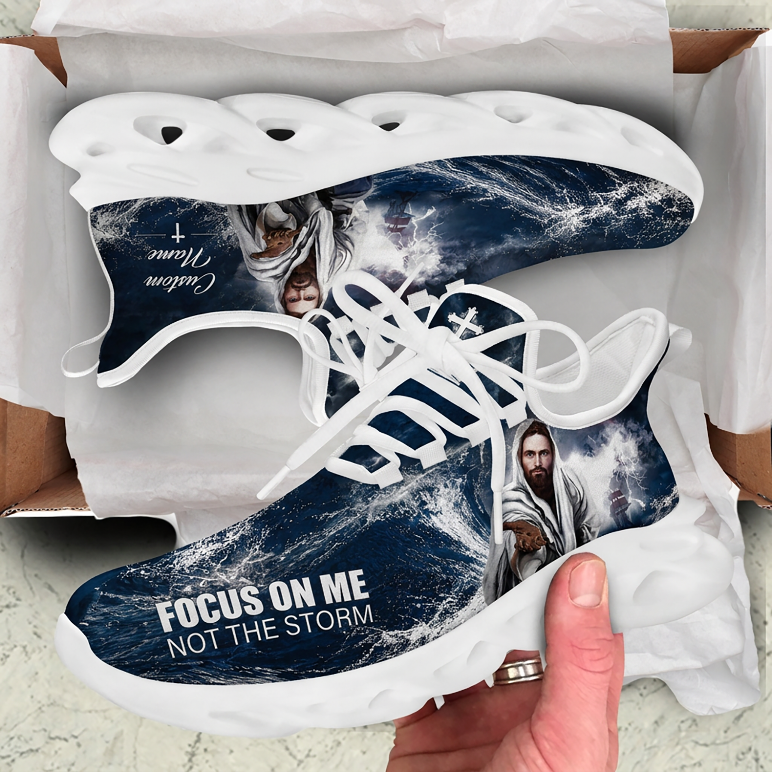 Unboxing presentation of the Christian sea storm faith sneakers nested inside a cardboard shipping box