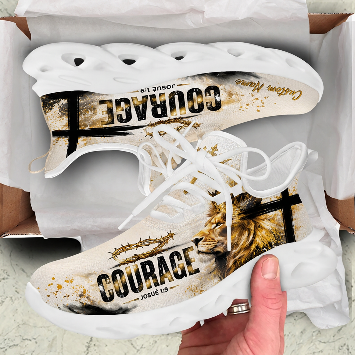 Unboxing perspective of the Portuguese Christian beige sneakers nested inside a cardboard shipping box
