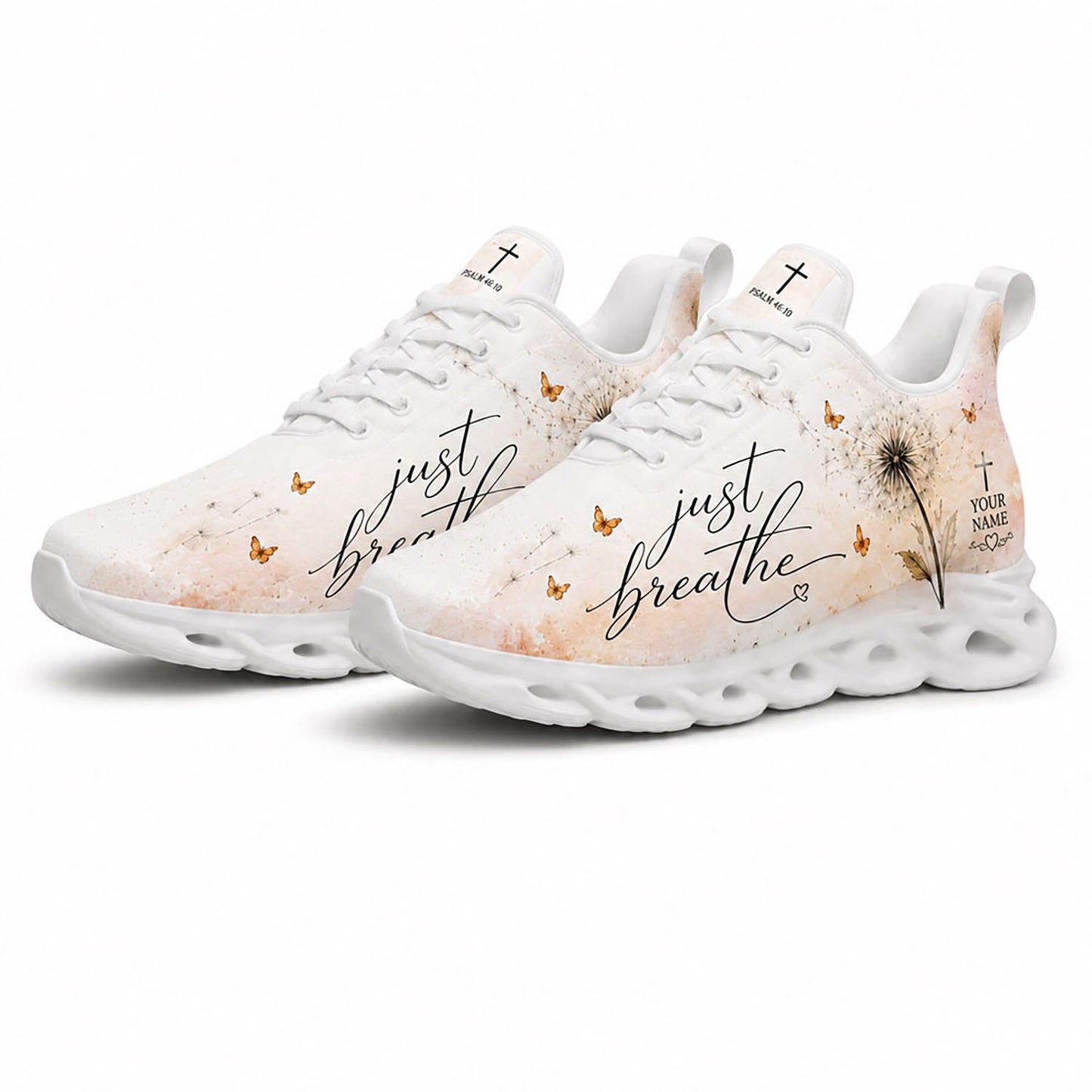 Angled pair of dandelion Christian sneakers with cream watercolor textures and Psalm 46:10 text on white soles