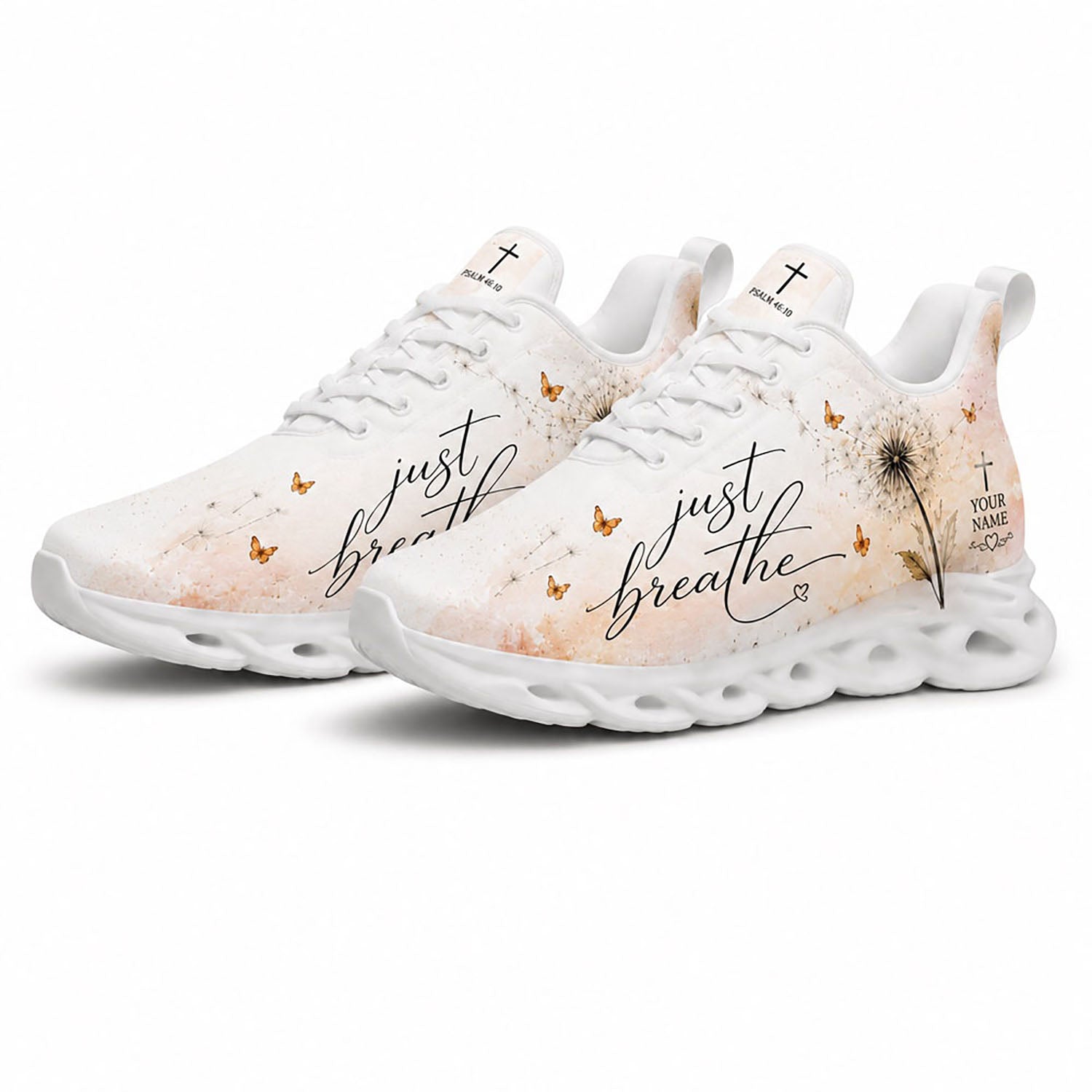 Angled pair of dandelion Christian sneakers with cream watercolor textures and Psalm 46:10 text on white soles