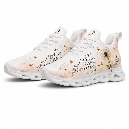 Angled pair of dandelion Christian sneakers with cream watercolor textures and Psalm 46:10 text on white soles