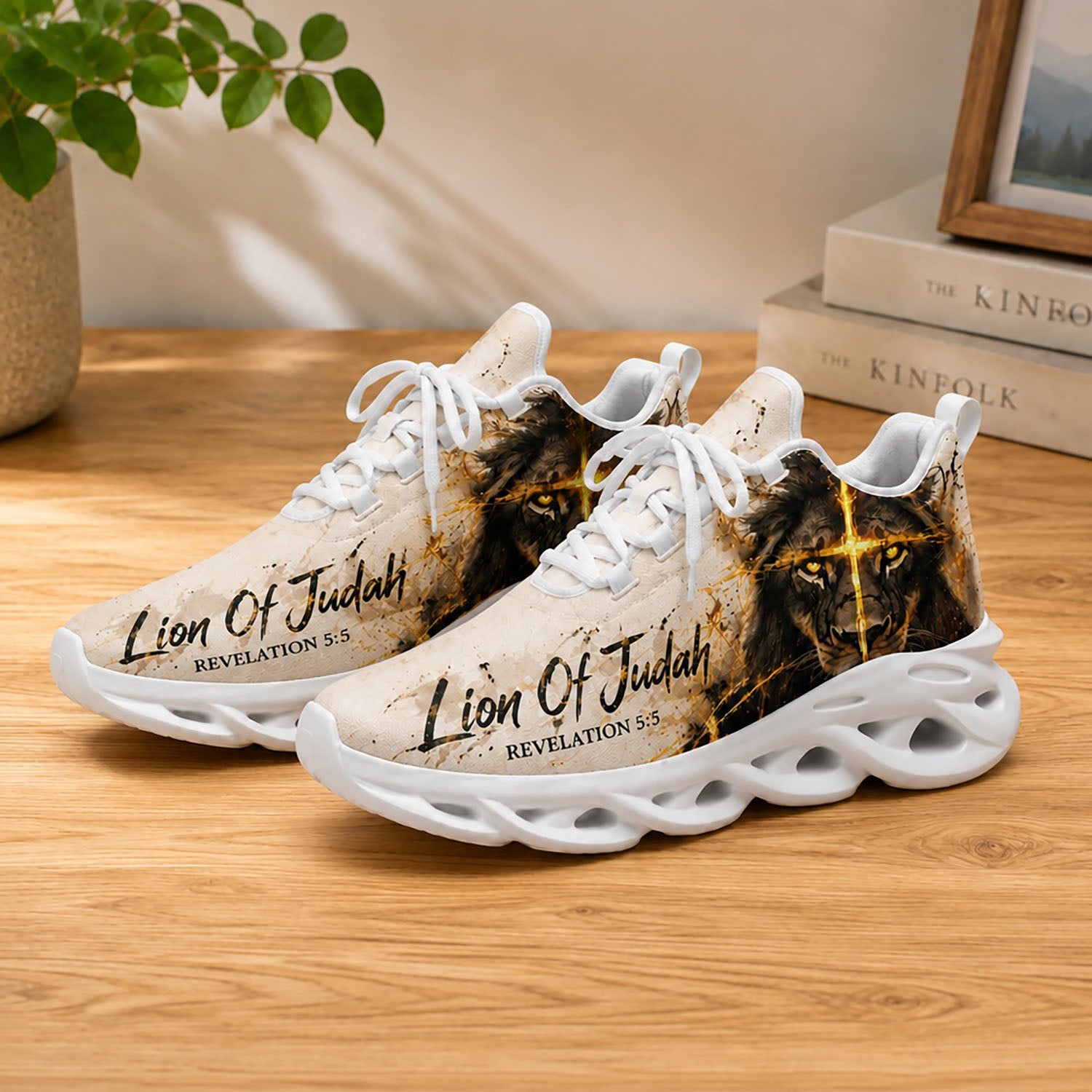 Lifestyle display of Custom Name Lion of Judah Max Soul shoes with white soles styled on a modern wooden table