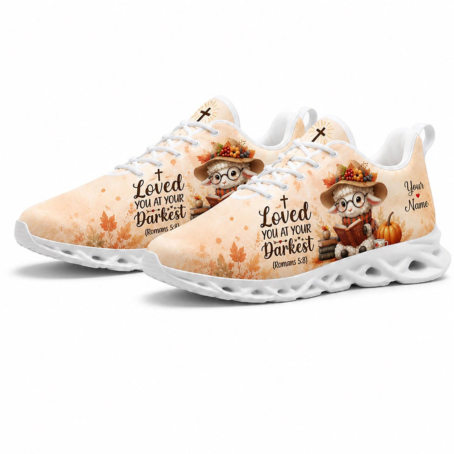 Angled view of a pair of custom autumn lamb sneakers with orange fall leaves and Romans 5:8 scripture on white soles