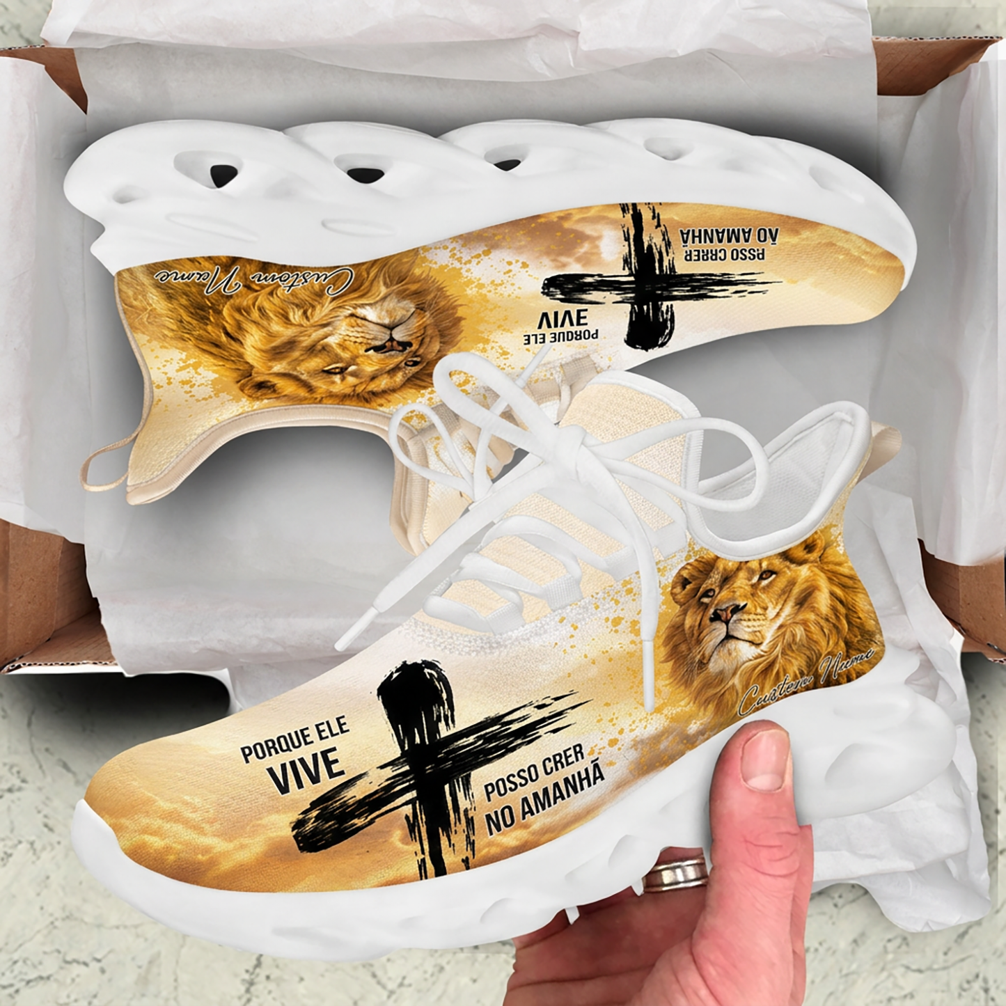 Unboxing perspective of the Portuguese Christian sneakers resting inside a cardboard box with white paper liner