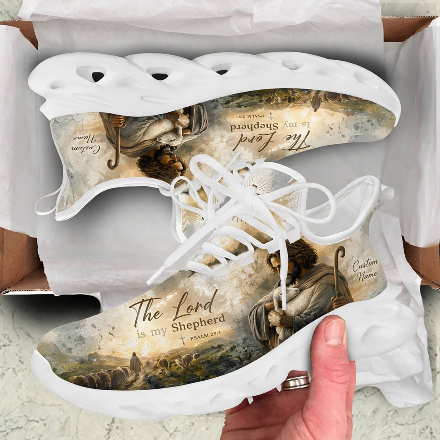 Unboxing perspective of the Christian oil painting sneakers presented inside a cardboard shipping box