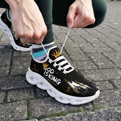 Close-up view of a person tying the laces of the white-soled custom Christian King of Kings shoes on outdoor brick pavement