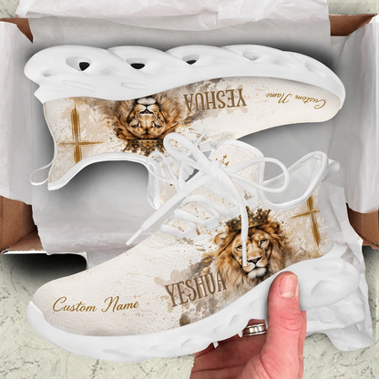 Unboxing view of the beige Christian sneakers displaying the Yeshua text and lion motif inside a shipping box