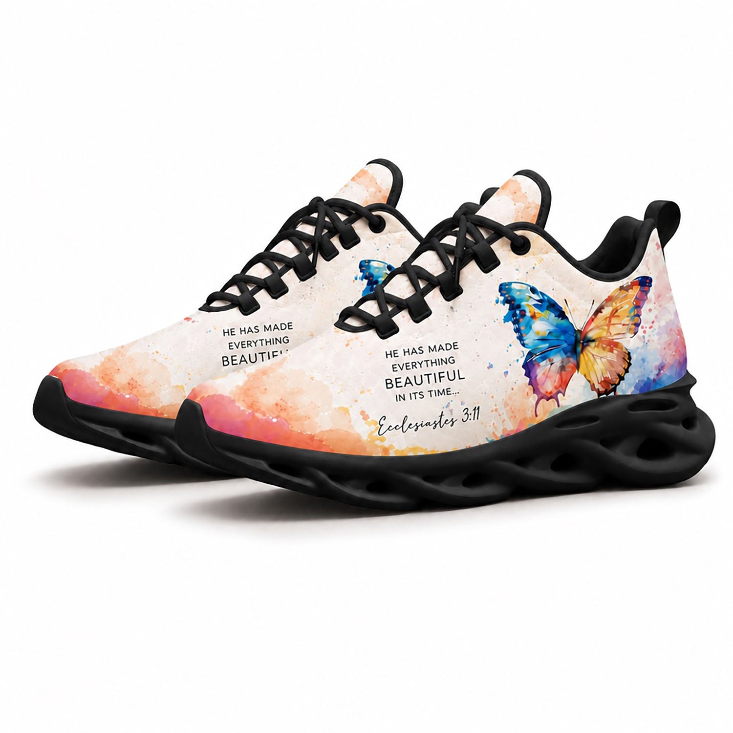 Pair of watercolor butterfly sneakers featuring a dynamic multi-color canvas print with black soles