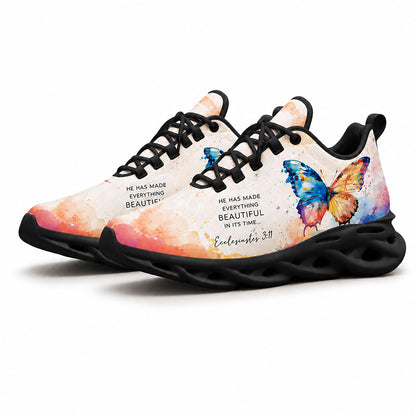 Pair of watercolor butterfly sneakers featuring a dynamic multi-color canvas print with black soles