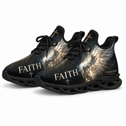 Angled studio shot of black-soled religious footwear featuring the celestial angel wing design