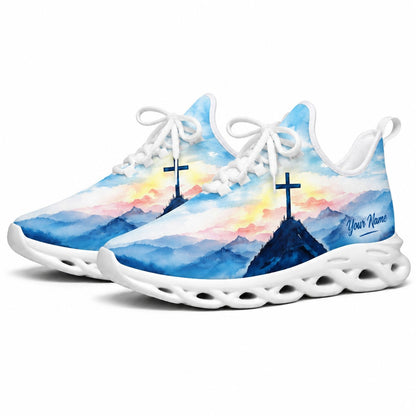 Studio 3/4 angle of Jesus Christ sports sneakers featuring serene watercolor nature artwork on white soles