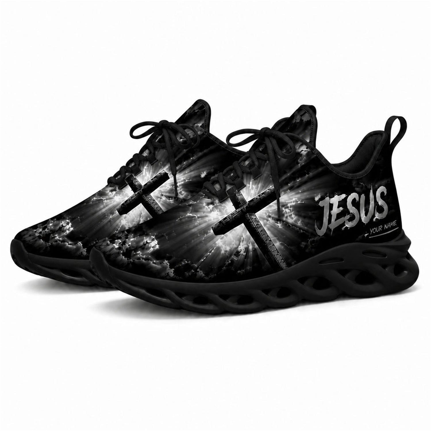 Angled studio shot of black-soled religious footwear featuring the glowing cross design