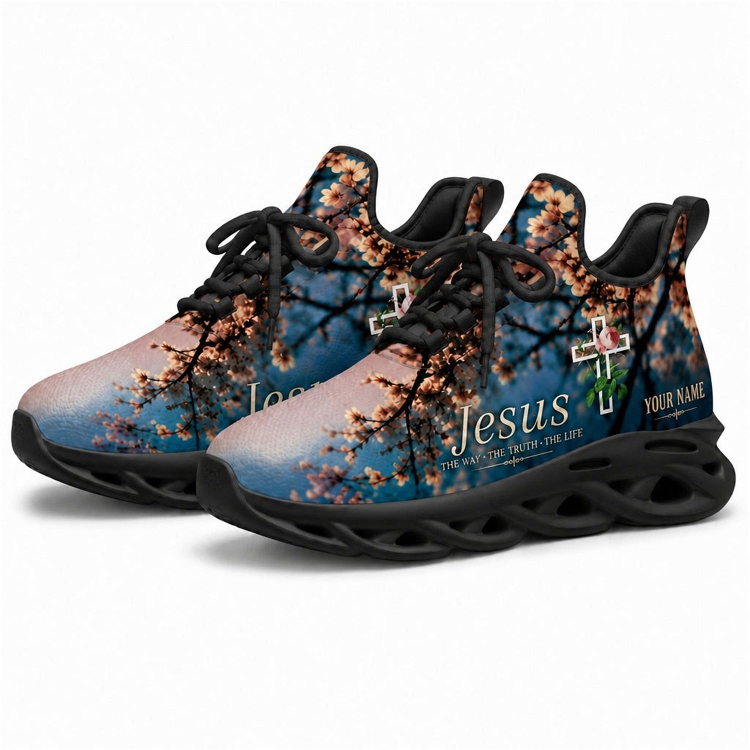 Angled studio shot of black-soled religious footwear featuring the Jesus floral cross design