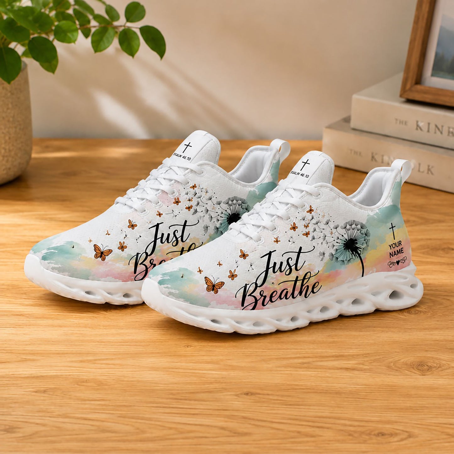Lifestyle product photography of Custom Name Just Breathe Psalm 46:10 Max Soul shoes with white soles styled on a wooden table