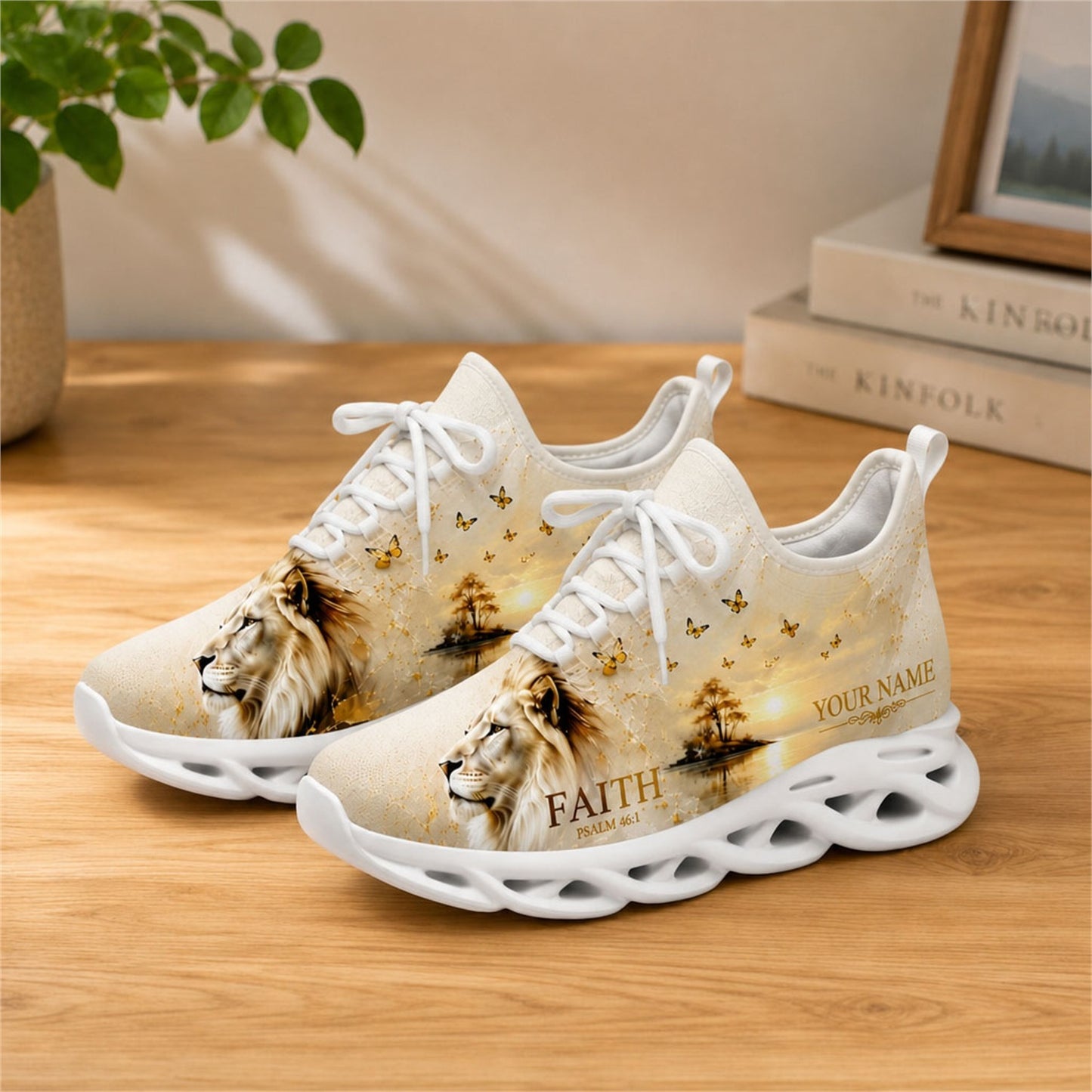 Lifestyle view of white-soled faith sneakers on a wooden surface, highlighting the lion and butterfly art