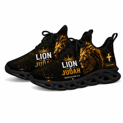 Angled studio shot of black-soled religious footwear featuring the Lion of Judah design