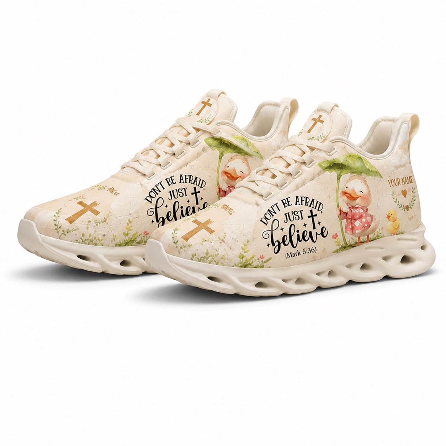 Angled pair of personalized cute Christian sneakers with cartoon duck graphic and holy scripture on white soles