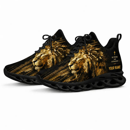Angled studio shot of black-soled religious sneakers highlighting the modern geometric lion artwork