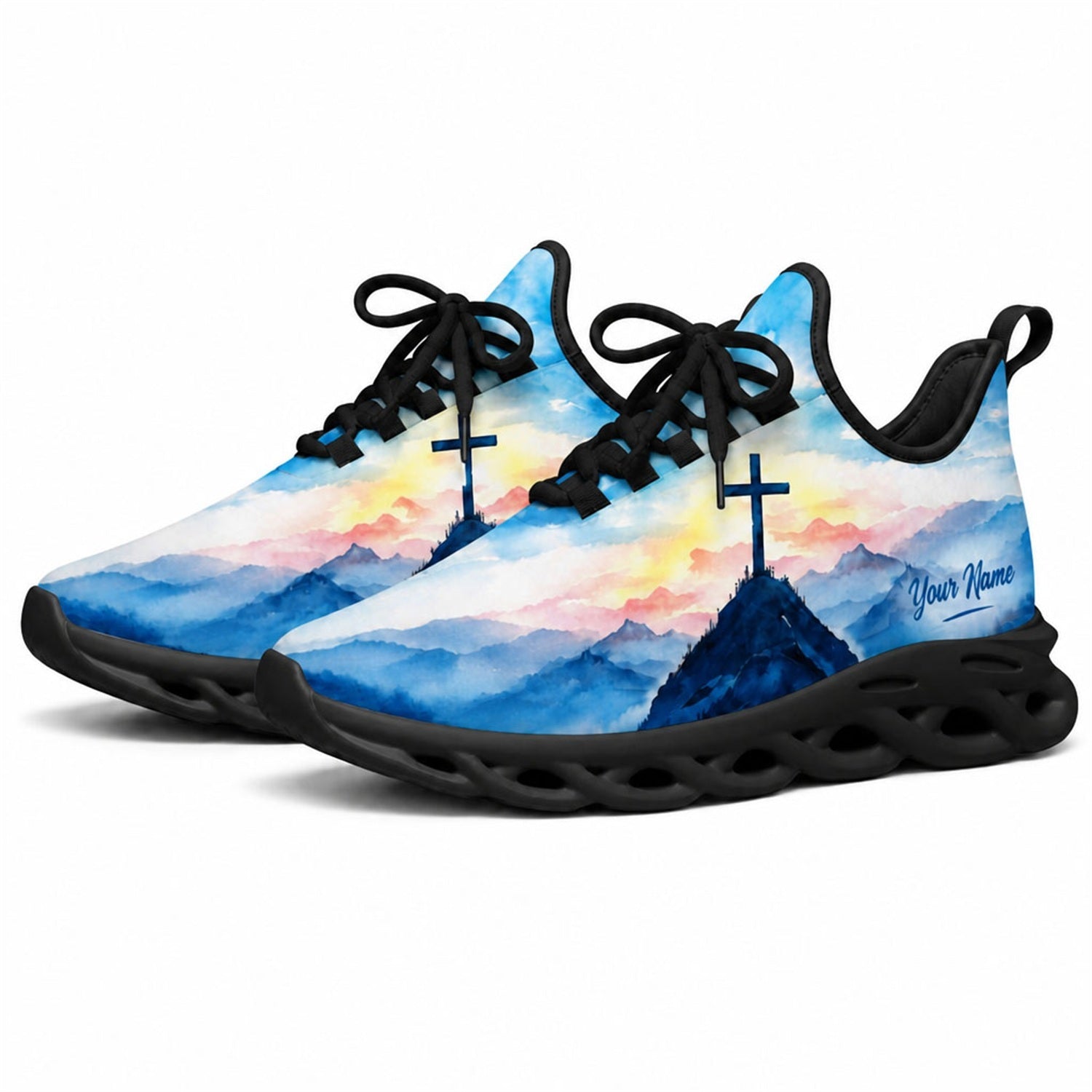 Angled studio shot of black-soled religious sneakers highlighting the serene watercolor faith scenery