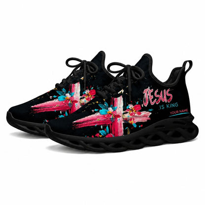 Angled studio shot of black-soled religious sneakers highlighting the modern colorful floral faith artwork