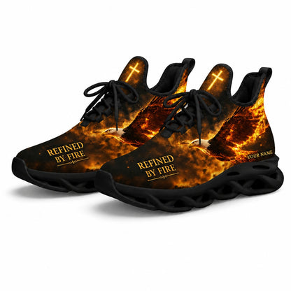 Angled studio shot of the black-soled religious athletic sneakers emphasizing the golden text placement and a bright glowing cross on the tongue