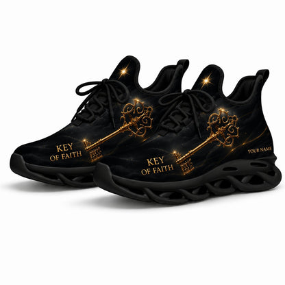 Angled shot of black-soled religious sneakers highlighting the elegant Key of Faith gold typography