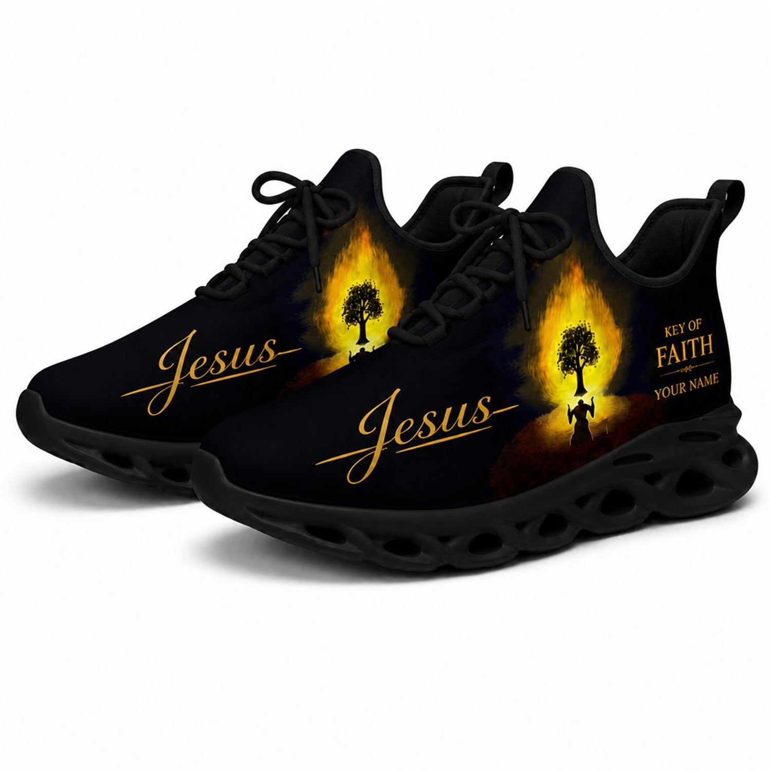 Angled studio shot of black-soled religious footwear highlighting the burning tree prayer graphic