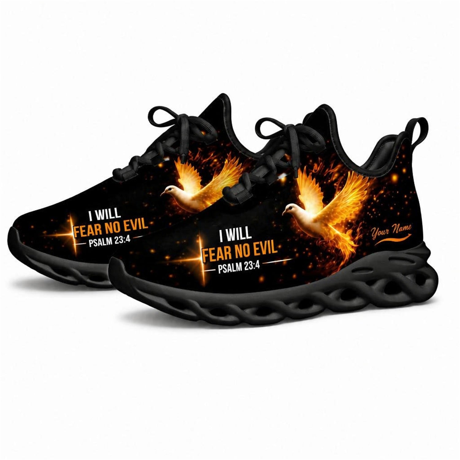 Angled studio shot of black-soled religious footwear highlighting the burning orange dove faith art