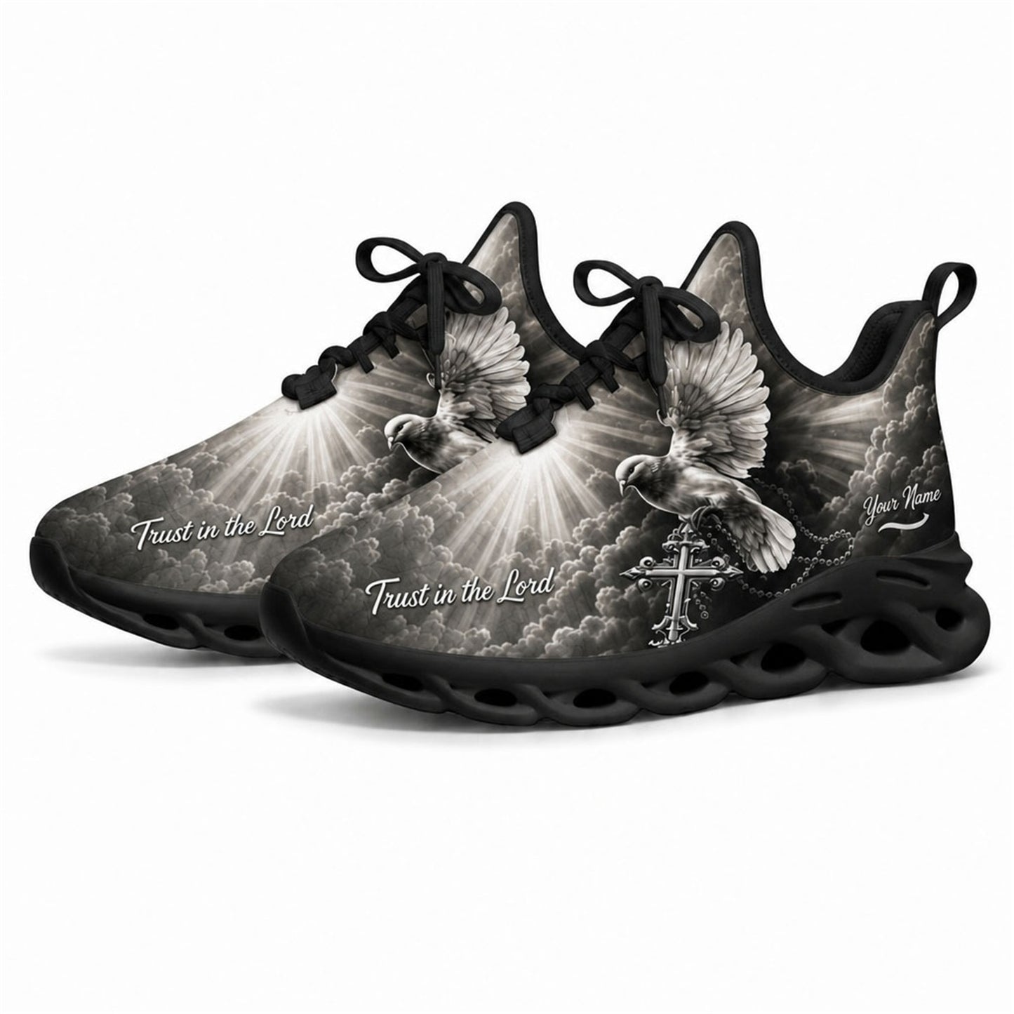 Angled studio shot of black wavy sole religious sneakers showing grayscale heavenly clouds and sunrays