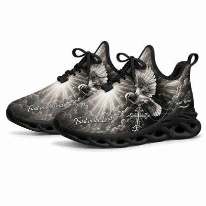 Angled studio shot of black wavy sole religious sneakers showing grayscale heavenly clouds and sunrays