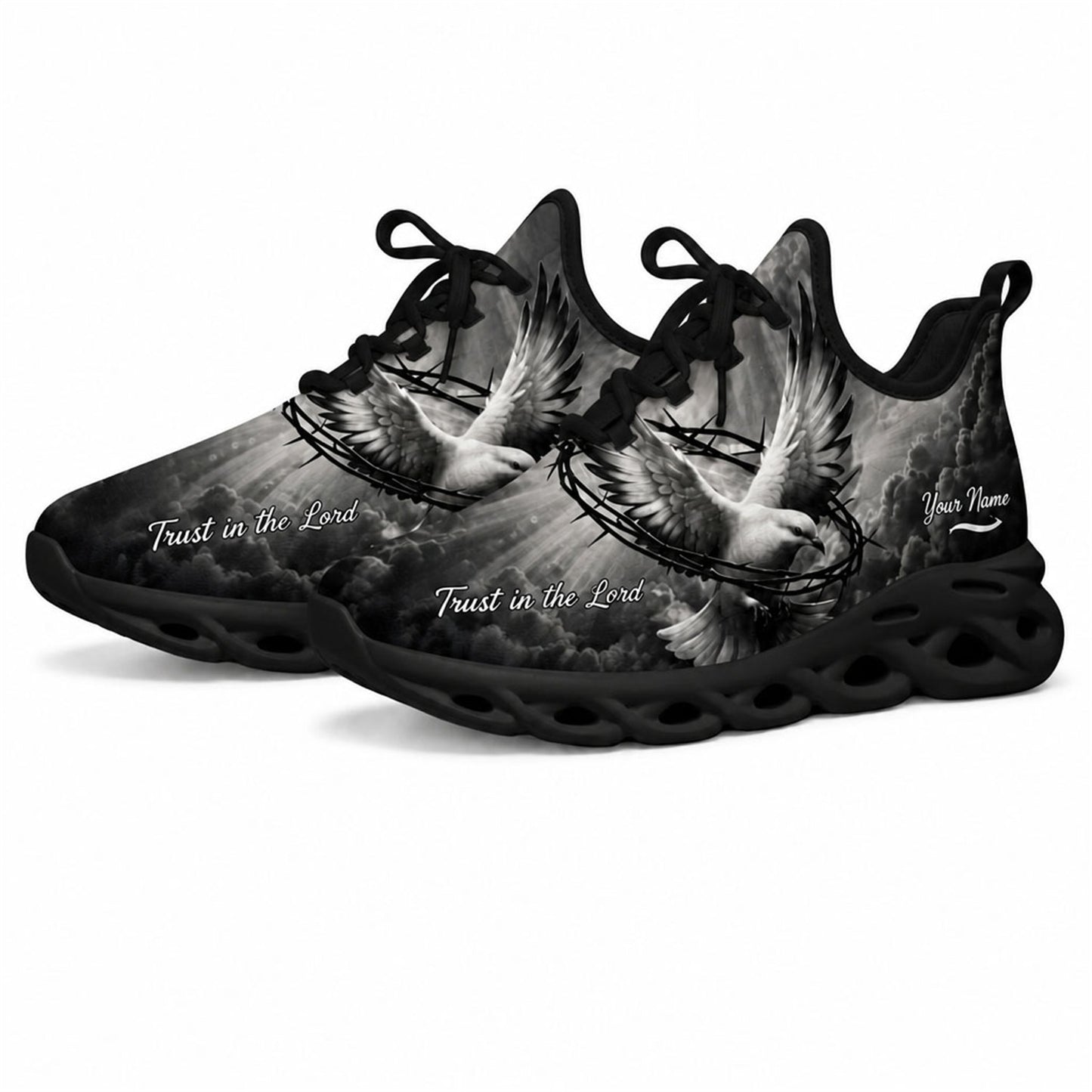 Angled studio shot of black wavy sole religious sneakers showing grayscale heavenly clouds and sunrays