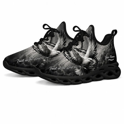 Angled studio shot of black wavy sole religious sneakers showing grayscale heavenly clouds and sunrays