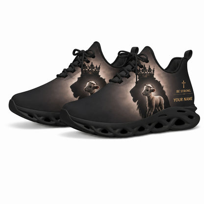Angled studio shot of black-soled religious sneakers highlighting the crowned lion silhouette graphics