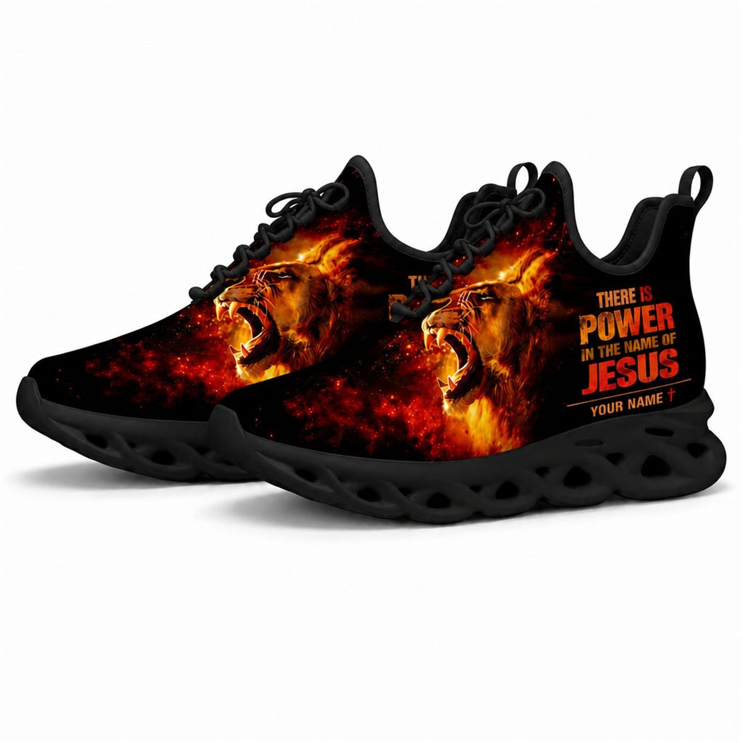 Angled studio shot of black-soled religious sneakers highlighting the intense lion in flames graphics