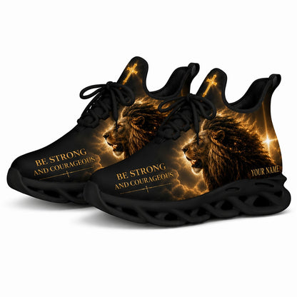 Angled studio shot of the black-soled religious athletic sneakers emphasizing the golden cloud print and glowing starburst cross