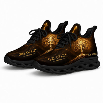 Angled studio shot of the black-soled religious athletic sneakers emphasizing the "Tree of Life" elegant typography and cosmic gold dust effect