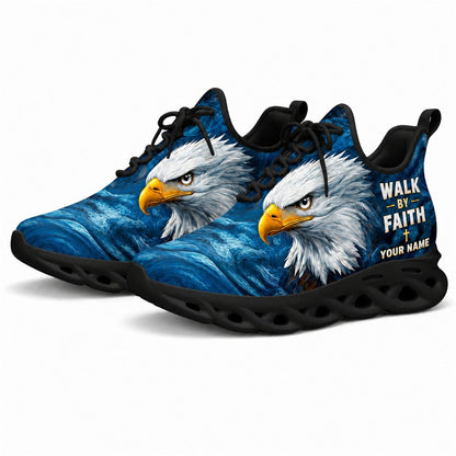Angled studio shot of black-soled religious sneakers highlighting the eagle portrait graphics